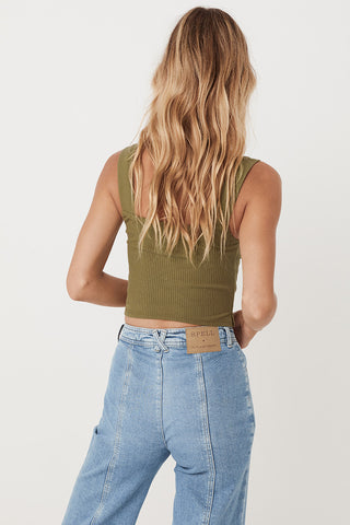 an-image-of-studio-model-lea-mohr-wearing-the-mazzy-ribbed-top-the-top-comes-in-a-khaki-colourway-and-features-a-square-neckline-and-thick-straps