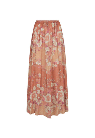 a-long-pleated-maxi-skirt-in-a-warm-peach-and-orange-floral-print-featuring-large-pink-and-cream-flowers-with-delicate-green-leaves-shown-against-a-plain-white-background