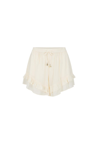 cream-ruffled-shorts-with-a-drawstring-waist-and-small-gold-decorative-accents-shown-against-a-plain-white-background