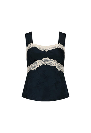 a-black-camisole-top-with-wide-shoulder-straps-featuring-a-textured-jacquard-fabric-and-a-double-band-of-cream-lace-trim-across-the-bust-and-waist-shown-against-a-plain-white-background