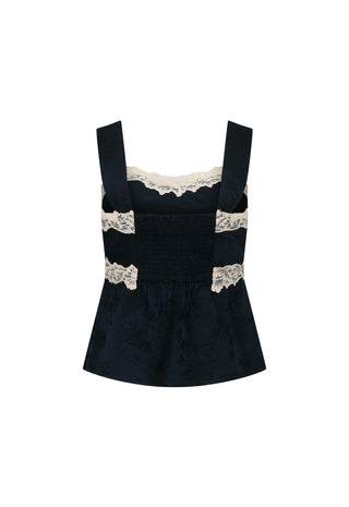 a-dark-navy-blue-velvet-like-smocked-top-with-wide-straps-and-beige-lace-trim-at-the-neckline-and-waist-shown-on-a-plain-white-background