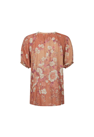 a-short-sleeve-blouse-with-a-gathered-pleated-bodice-and-a-soft-floral-print-in-dusty-pink-peach-and-cream-shown-against-a-plain-white-background