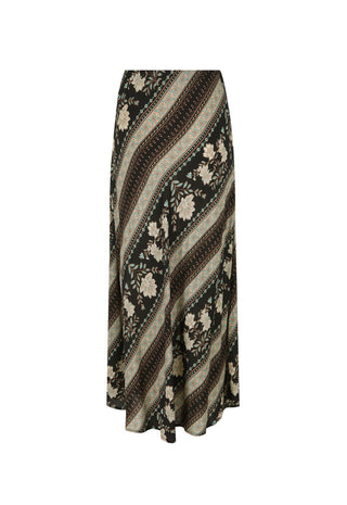 A woman modeling a two-piece bohemian maxi set with a black