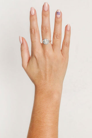close-up-image-of-a-hand-with-painted-nails-wearing-rings-including-that-of-the-spell-s-silver-stargazer-zodiac-ring