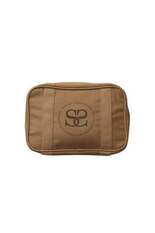 The camel Curators Club Cosmetic Bag. The bag features a zip opening and logo on the front.