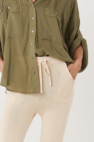 studio-model-lea-mohr-wearing-the-spell-linda-knit-pants-the-pants-come-in-a-sand-colourway-and-feature-functional-pockets-a-functional-drawstring-waist-tie-and-knit-detailing-down-the-legs