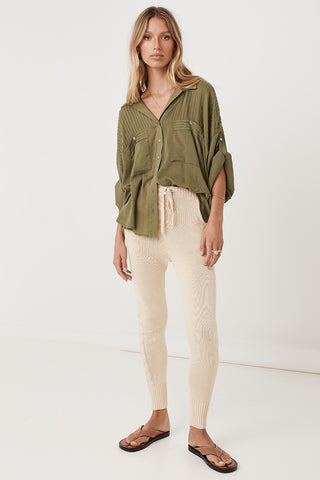 studio-model-lea-mohr-wearing-the-spell-linda-knit-pants-the-pants-come-in-a-sand-colourway-and-feature-functional-pockets-a-functional-drawstring-waist-tie-and-knit-detailing-down-the-legs