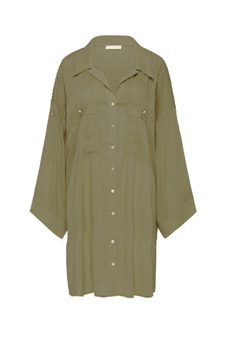 studio-model-lea-mohr-wearing-the-spell-linda-mini-dress-the-mini-dress-comes-in-a-khaki-colourway-and-features-patch-pockets-on-the-front-side-splits-a-shell-button-down-front-a-drop-shoulder-full-length-sleeve-and-a-button-tab-on-the-sleeve