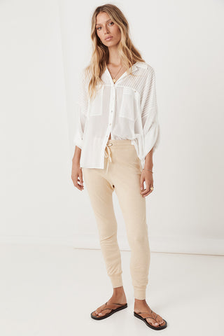 studio-model-lea-mohr-wearing-the-spell-maverick-racer-stripe-trackpants-the-pants-come-in-a-stone-colourway-and-feature-a-waistband-with-drawstring-and-a-contrast-stripe-down-the-outer-leg