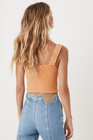 an-image-of-studio-model-lea-mohr-wearing-the-mazzy-ribbed-top-the-top-comes-in-an-almond-colourway-and-features-a-square-neckline-and-thick-straps