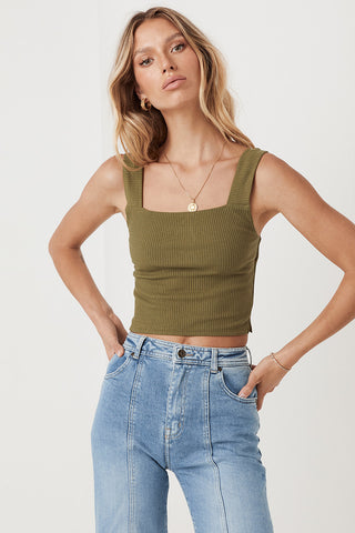 an-image-of-studio-model-lea-mohr-wearing-the-mazzy-ribbed-top-the-top-comes-in-a-khaki-colourway-and-features-a-square-neckline-and-thick-straps