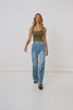 A video of studio model, Lea Mohr, wearing the Mazzy Ribbed Top. The top comes in a khaki colourway and features a square neckline and thick straps. 
